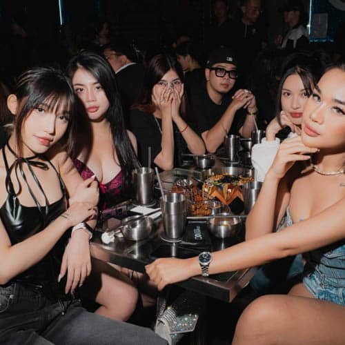 Happy customers enjoying VIP services at Nightlife Vietnam venue