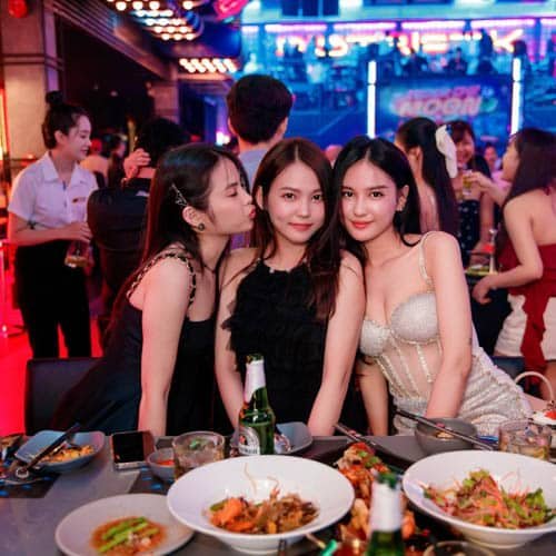 Happy customers enjoying VIP services at Nightlife Vietnam venue